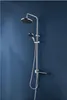 A shower set mounted on a blue wall. Produktbild-Vorschau