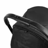 Close-up of a black stroller handle. Náhľad obrázku produktu