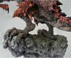A close-up view of a detailed statue of a monster, focusing on its clawed feet and textured body, standing on a rocky base. Produktbild-Vorschau