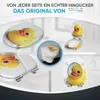 A collage of images showcasing a toilet seat with a rubber duck design from various angles and perspectives, including a close-up of the seat and a toilet in a bathroom setting. Náhled obrázku produktu