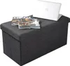 A dark gray storage ottoman with magazines and a laptop on top, set against a white background. Produktbild-Vorschau