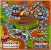 A colorful board game depicting a race track with various obstacles and scenery, including a volcano, river, and desert. Voir les images du produit