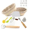 A collection of baking tools, including proofing baskets, a dough scraper, brushes, a whisk, and blades. Produktbild-Vorschau