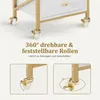 Close-up of the wheels of a white and gold rolling cart, with text and diagrams explaining their functionality. Produktbild-Vorschau