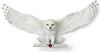 A white owl with wings spread wide, perched on a branch with a red gem. Produktbild-Vorschau