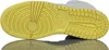 The image shows the sole of a white and yellow Nike Air Jordan 1 Mid sneaker, with a reflection visible below. Podgląd zdjęcia produktu