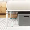 Detailaufnahme der Bodenfreiheit des Betts mit Pfeil und Maßangabe: 26.4 cm Stauraumhöhe.
 Produktbild-Vorschau