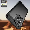 A black phone case with a carbon fiber texture is shown at an angle, resting on a rocky, desert-like surface. Produktbild-Vorschau