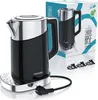 A black and silver electric kettle with its base and power cord, displayed on a white surface. A product box is visible in the background. Produktbild-Vorschau