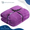A folded purple blanket tied with a black ribbon, with marketing text and a logo. Produktbild-Vorschau