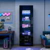 A modern gaming room setup with a black high-gloss display cabinet filled with various items, illuminated by blue and pink LED lights. A desk with a computer, monitor, and gaming accessories is also visible. Anteprima dell’immagine prodotto