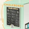 A close-up of a children's play kitchen with a chalkboard menu. Produktbild-Vorschau