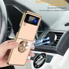 A gold flip phone case with a ring holder is shown attached to a magnetic car mount inside a car. Produktbild-Vorschau