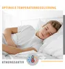 A young person sleeping peacefully in a bed. Produktbild-Vorschau