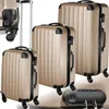 Three suitcases of varying sizes are displayed against a white background. A black combination lock is also visible in the foreground. Náhled obrázku produktu
