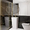 A modern bathroom with black marble tiles, a white pedestal sink, and a toilet. Produktbild-Vorschau
