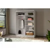A white wardrobe with sliding doors is shown, filled with folded clothes, a hanging shirt, and a backpack. The wardrobe is in a room with a window showing a landscape and a rug on the floor. Produktbild-Vorschau