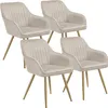 Four beige upholstered dining chairs with gold legs are arranged in a staggered formation against a white background. Voir les images du produit