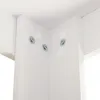 A close-up view of the corner of a white table, showing screws and screw covers. Produktbild-Vorschau