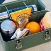 A green metal lunchbox filled with food and a thermos. Podgląd zdjęcia produktu