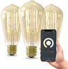 A hand holding a smartphone displaying a smart lighting app, with three smart LED bulbs in the background. Produktbild-Vorschau