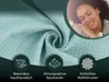 A close-up of a teal waffle-patterned fabric is shown, with a woman sleeping peacefully in the upper right corner. Three circular icons with text below them are displayed at the bottom. Produktbild-Vorschau