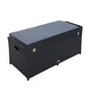 A black rattan storage bench with a gray cushion, shown against a white background. Produktbild-Vorschau