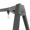 A close-up view of the metal frame of a swing set, showing a carabiner clip and a branded plate. Produktbild-Vorschau