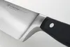 A close-up shot of a Wüsthof Classic vegetable knife. Voir les images du produit