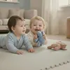 Two babies are playing on a puzzle mat with toys. Anteprima dell’immagine prodotto