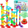 A colorful marble run toy set with many pieces and marbles, along with its packaging. Produktbild-Vorschau
