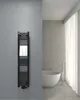 A black towel radiator with a white towel hanging on it, placed on a gray wall in a modern bathroom with a white bathtub and sheer curtains. Produktbild-Vorschau