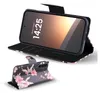 A phone case with a floral pattern is shown in two views: one open with a phone inside, and another closed and standing up. Produktbild-Vorschau