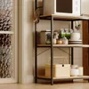 A kitchen shelf unit with various items on it, including a microwave, jars, bowls, and a basket. Podgląd zdjęcia produktu