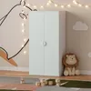 A child's room with a wardrobe, toys, and decorations. Anteprima dell’immagine prodotto