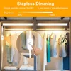 LED lights installed in a closet with clothes hanging. Produktbild-Vorschau