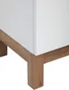 Close-up of the bottom corner of a white cabinet with wooden legs. Podgląd zdjęcia produktu