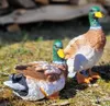 2 Stück Enten Entenfiguren stehend/liegend Dekoration Haus Produktbild-Vorschau 3