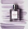 A bottle of perfume is placed on a background with purple brush strokes. Náhľad obrázku produktu