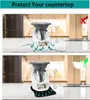Two images showing a kitchen appliance on a countertop. The top image shows the appliance causing damage to the countertop, while the bottom image shows a protective mat preventing damage. Produktbild-Vorschau