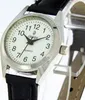 Close-up of a women's wristwatch with a black leather strap. Produktbild-Vorschau