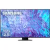 A Samsung QLED smart TV is displayed front and center on a stand against a white background. The screen shows a colorful, abstract image with purple and blue hues. Produktbild-Vorschau