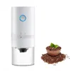 A white electric coffee grinder is shown next to a bowl of coffee beans. Produktbild-Vorschau