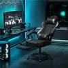A gaming chair is set up in a modern gaming room with blue ambient lighting. Produktbild-Vorschau
