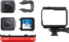 A collection of camera components and accessories, including camera modules, a mounting bracket, and a battery base. Náhled obrázku produktu