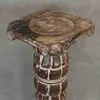 A close-up view of a wooden decorative column stand. Produktbild-Vorschau