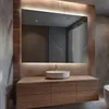 A modern bathroom vanity with a large illuminated mirror. Produktbild-Vorschau