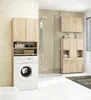 A modern bathroom with a washing machine and storage units. Anteprima dell’immagine prodotto