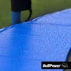 Close-up of a blue surface with water droplets, possibly a trampoline mat, with a green net in the background. Produktbild-Vorschau