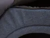 A close-up view of the textured fabric and zipper of a dog house. Náhled obrázku produktu